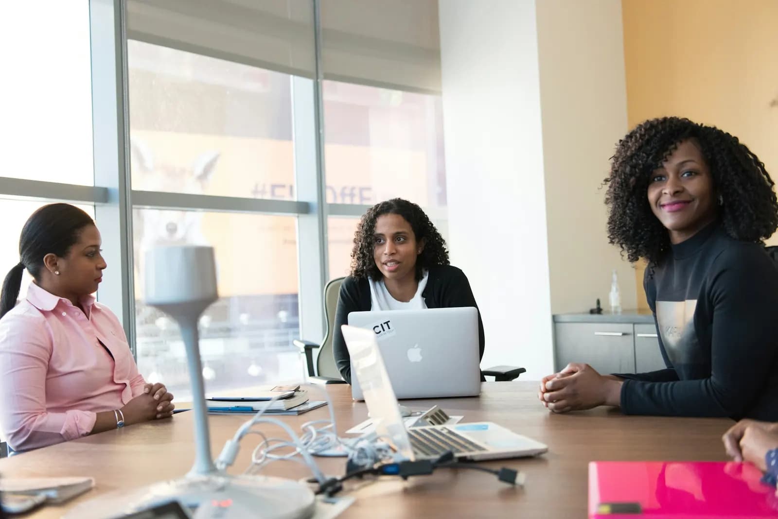Professionals discussing a strategy around a table